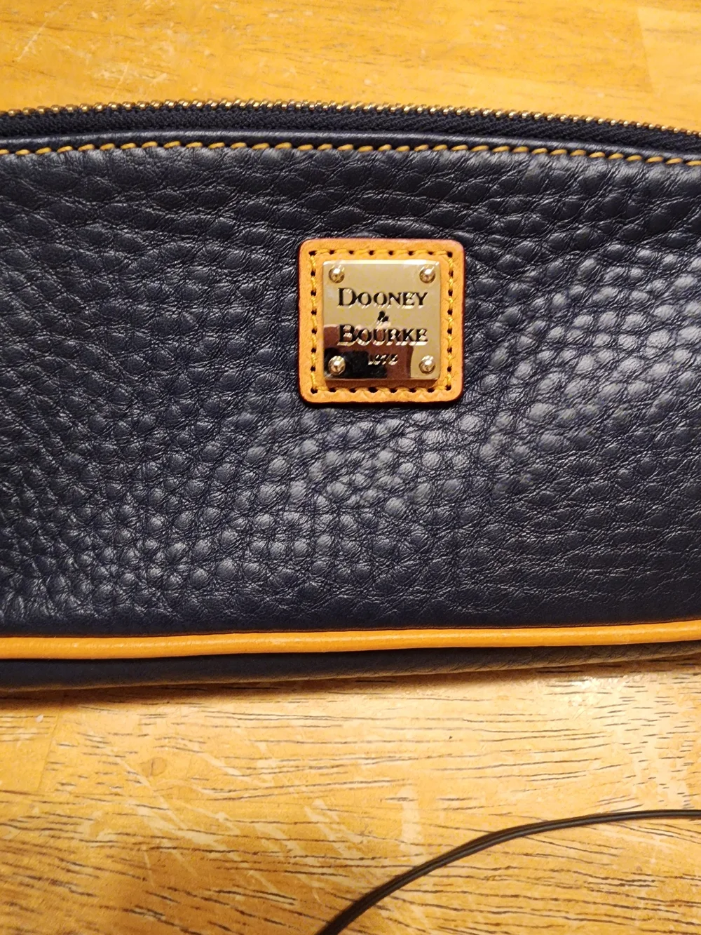 Dooney & Bourke Pebble Grain Slim Cosmetic slim pouch in navy blue Leather